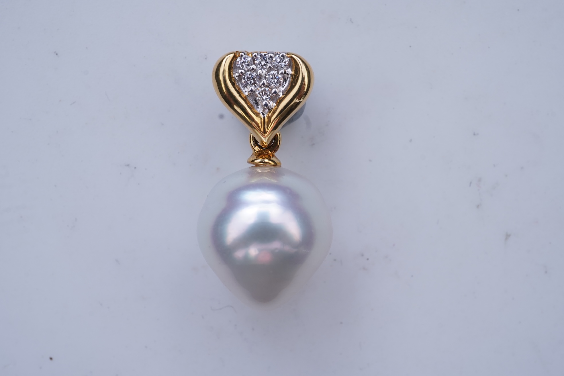 A cultured pearl and diamond pendant